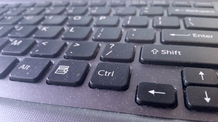 Laptop keyboard close up with dust